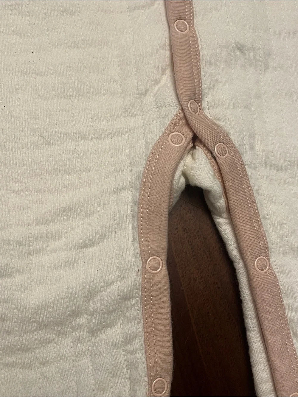 Cream Baby Footed One-Piece with Beige Trim and Sleeping Bear